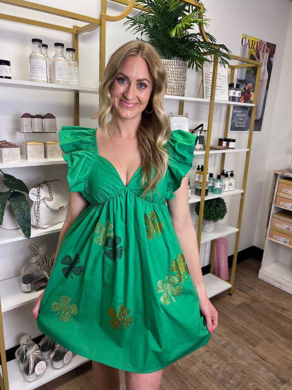 Lily Mae Green Dress with Ruffled Shoulders and Rhinestone Clovers | Sparkles & Lace Boutique Lily Mae Green Dress with Ruffled Shoulders and Rhinestone Clovers | Sparkles & Lace Boutique